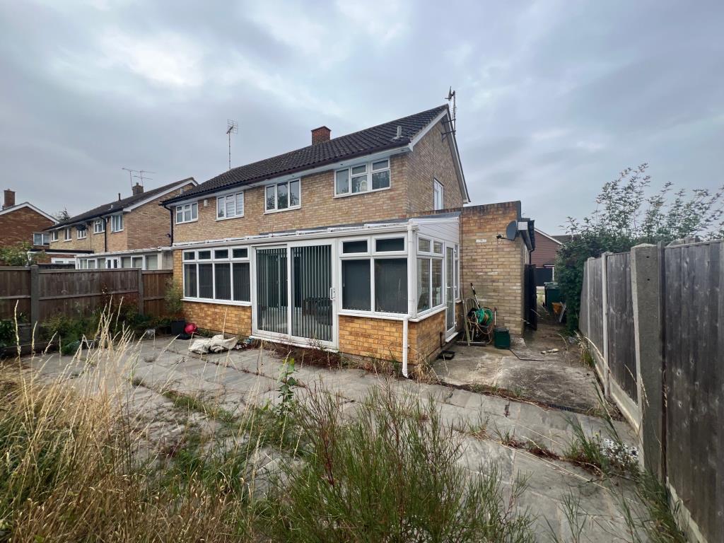 Lot: 102 - SEMI-DETACHED HOUSE FOR INVESTMENT OR OWNER-OCCUPATION - Rear aspect of house showing patio leading to conservatory and side gate